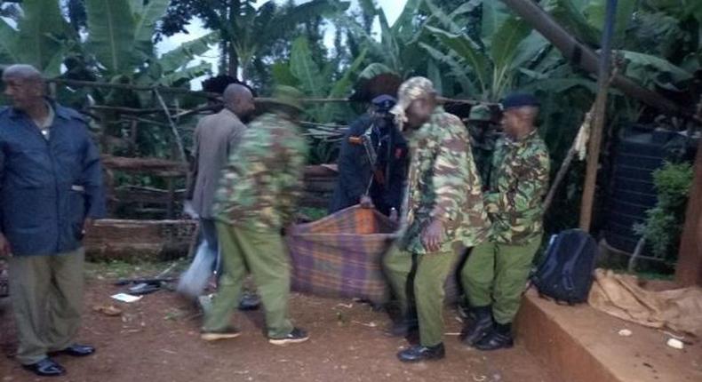 Police carry away a dead body during a past incident (Twitter)