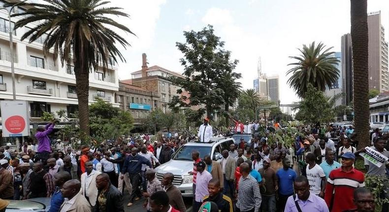 Kenyan opposition leader of the Coalition for Reforms and Democracy (CORD), Raila Odinga (C) leads his supporters during a protest near the premises hosting the headquarters of Independent Electoral and Boundaries Commission (IEBC) to demand the disbandment of the electoral body ahead of next year's election in Nairobi, Kenya June 6, 2016. 