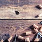 Corks from wine and opener on wooden table