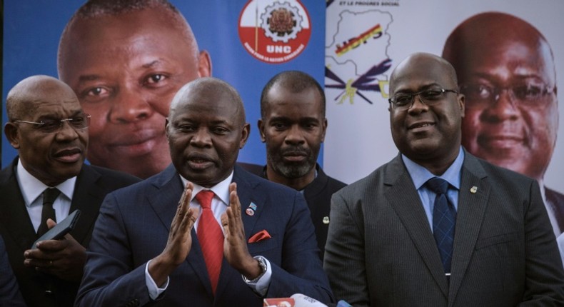 Vital Kamerhe, with the red tie, next to Felix Tshisekedi, right, during the 2018 election campaign