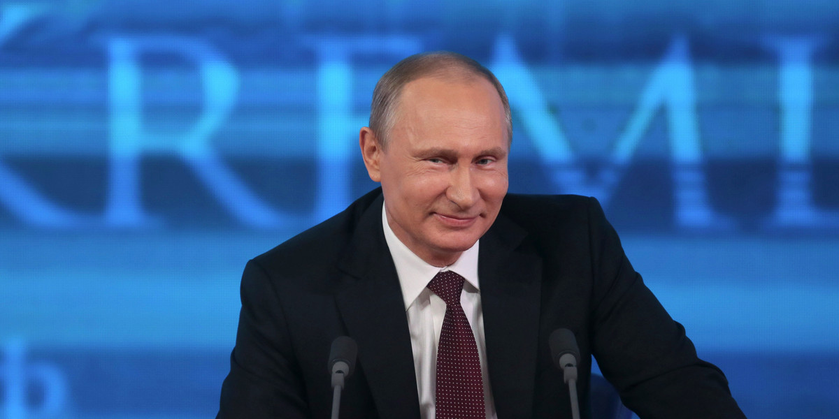 Vladimir Putin takes part in a televised news conference in Moscow on December 19, 2013.