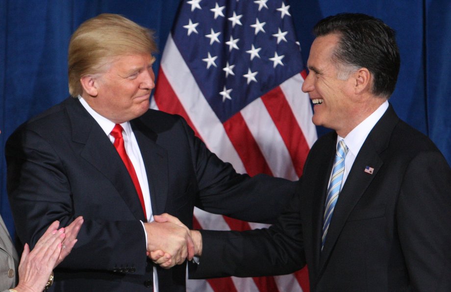 Donald Trump greets Mitt Romney after endorsing Romney's candidacy for president in 2012.