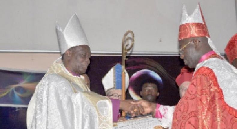 Dr Asafo-Agyei Anane Frempong (left) receiving the certificate of office after being sworn in