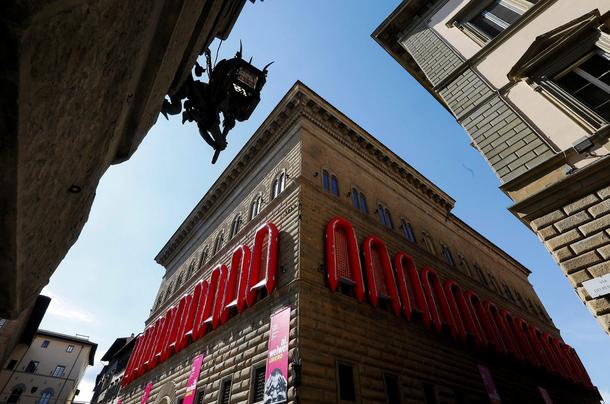 Twenty two rubber boats hang on the Palazzo Strozzi's facade as part of the installation entitled R