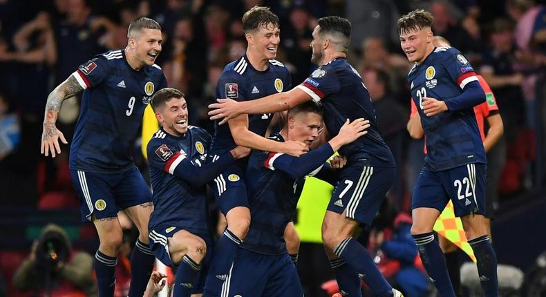 Scotland players celebrate against Israel Creator: ANDY BUCHANAN