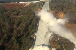 A damaged spillway with eroded hillside is seen in an aerial photo taken over the Oroville Dam in Or