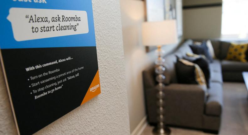 Prompts on how to use Amazon's Alexa personal assistant are seen as a WiFi-equipped Roomba begins cleaning a room in an Amazon 'experience center' in Vallejo, California, U.S., May 8, 2018.