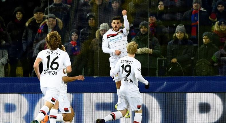 Leverkusen's players celebrate a goal on November 22, 2016