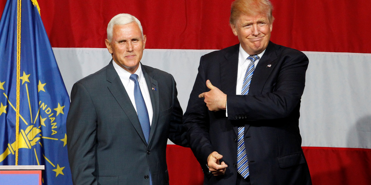 Republican presidential candidate Donald Trump, right, and Indiana Governor Mike Pence, left, wave to the crowd at a campaign stop on July 12, 2016.