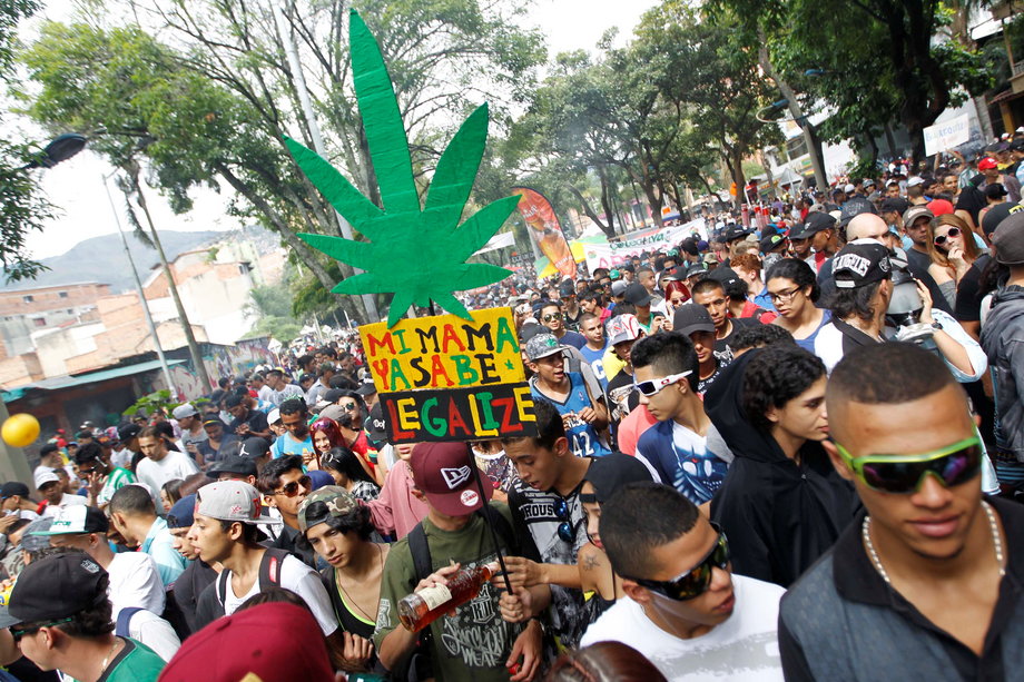 Thousands of people take part in a global March for marijuana in Medellin, Colombia, May 7, 2016. The sign reads, "My mother already knows. Legalize."