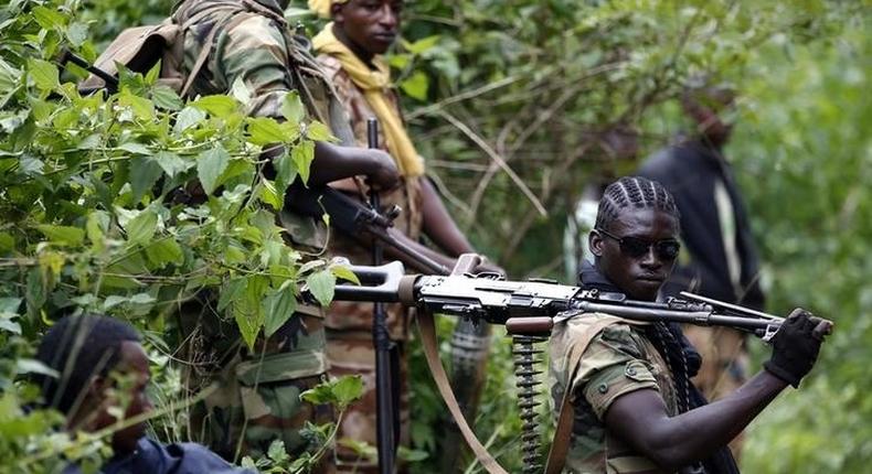 A Seleka fighter holds his machine gun near the town of Kuango, close to the border with Democratic Republic of Congo June 9, 2014. 