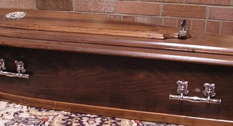 Dead woman comes back to life in a coffin.