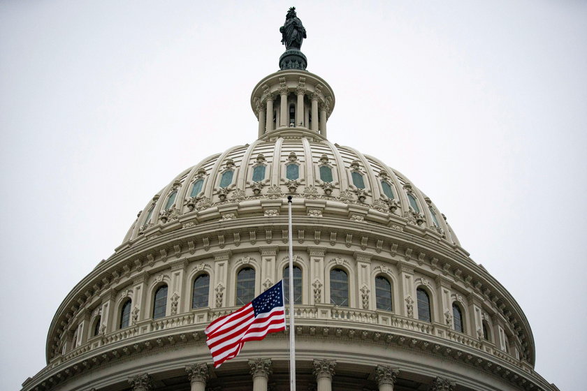 The American flag flies at half staff at the U.S. Capitol Building on the fifth day of the impeachme