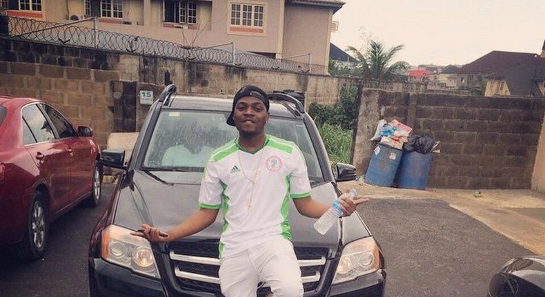 Olamide poses with Alexander Okeke's newly acquired 4matic GLK 350 Benz valued at N10m