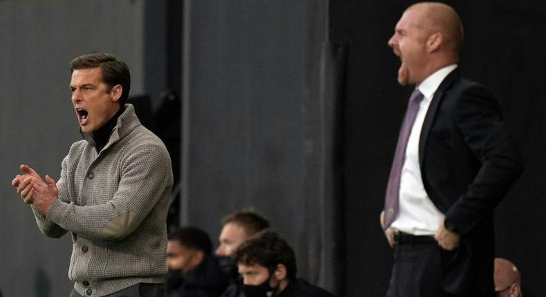 Going down, staying up - Rival managers Scott Parker (Fulham, L) and and Sean Dyche (Burnley R) urge their sides on during a x-x win for Burnley that saw Fulham relegated from the Premier League Creator: John Walton