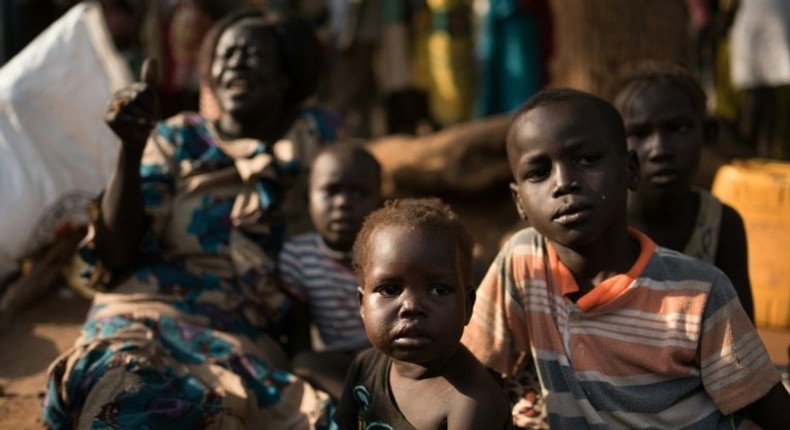 Families wait to find shelter in Juba on July 12, 2016 