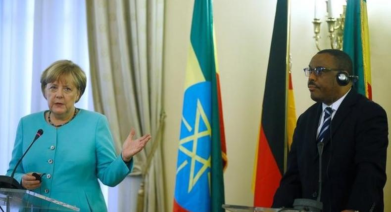 German Chancellor Angela Merkel gestures next to Ethiopian Prime Minister Hailemariam Desalegn during a news conference in Addis Ababa