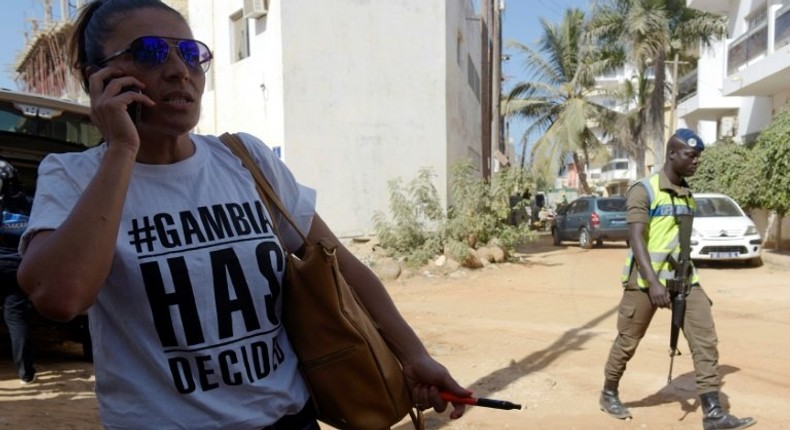 A supporter of Gambia's president-elect Adama Barrow pictured outside of the Gambian Embassy in Senegal's capital Dakar on January 19, 2017, ahead of Barrow's inauguration