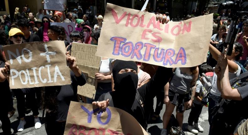 Demonstrators in Mexico City protest on August 12 the recent rape of two teenage girls