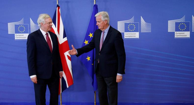The European Union's chief Brexit negotiator Michael Barnier (R) welcomes Britain's Secretary of State for Exiting the European Union David Davis at the European Commission ahead of their first day of talks in Brussels, June 19, 2017.
