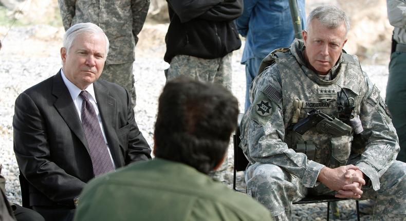 Then-US Secretary of Defense Robert Gates, left, and US Army Gen. David McKiernan, top US and NATO commander in Afghanistan, with Afghan officials in the mountains of Wardak Province, May 8, 2009.