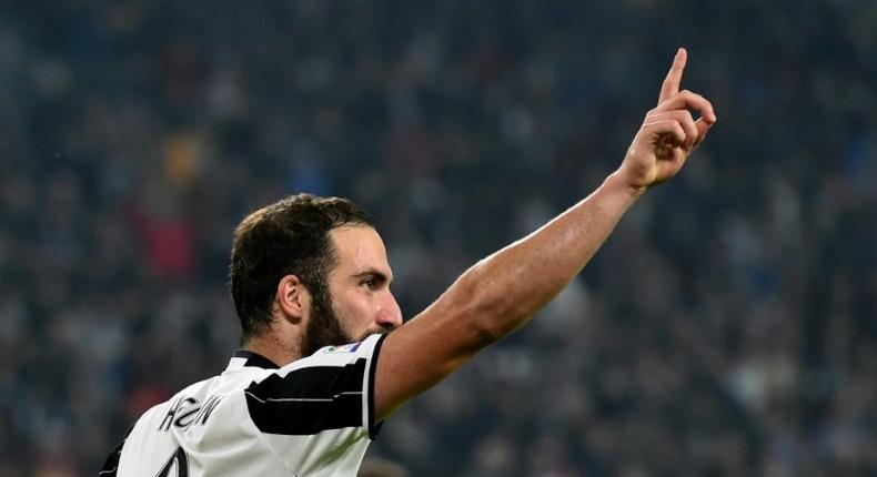 Juventus' forward Gonzalo Higuain celebrates after scoring a goal in Turin on October 29, 2016