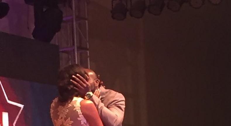 Seun Akindele and Roseanne Marcel sharing a kiss at the 2015 Best of Nolywood Awards 