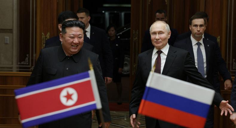 In this pool photograph distributed by the Russian state agency Sputnik, North Korea's leader Kim Jong Un (L) walks with Russian President Vladimir Putin during a welcoming ceremony upon Putin's arrival in Pyongyang.GAVRIIL GRIGOROV/POOL/AFP via Getty Images