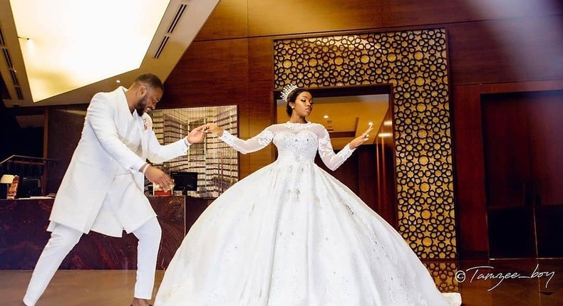 Bam Bam and Teddy A are couple goals in their unique wedding outfits [Instagram/ BellaNaija Weddings]