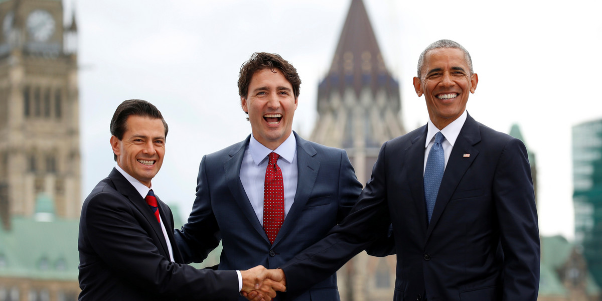 Against the backdrop of Parliament, Mexican President Enrique Pena Nieto, left, Canadian Prime Minister Justin Trudeau, center, and US President Barack Obama pose for a group photo at the North American Leaders' Summit in Ottawa, Canada, June 29, 2016.