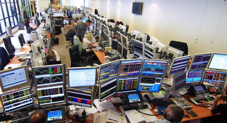 Paris on October 4th, 2011 . Aurel BGC. trading floor The CAC40 index and the Paris stock exchange curve over the past 5 days appear on the computer screens Traders at work. (Photo by: Andia/Universal Images Group via Getty Images)
