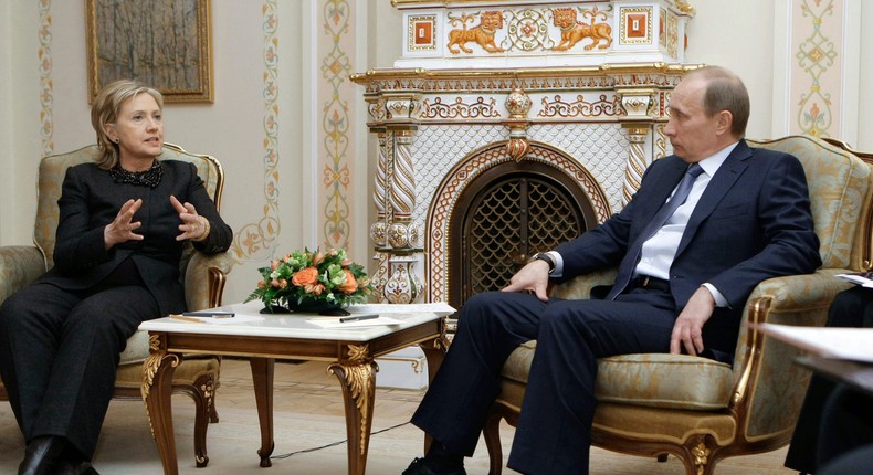 US Secretary of State Hillary Clinton (L) speaks with Russian Prime Minister Vladimir Putin (R) outside Moscow in Novo-Ogarevo on March 19, 2010.