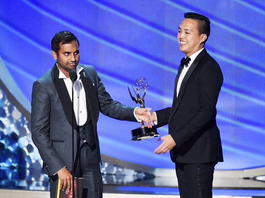 Aziz Ansari, left, and Alan Yang accept their 2016 Emmy for writing on "Master of None."