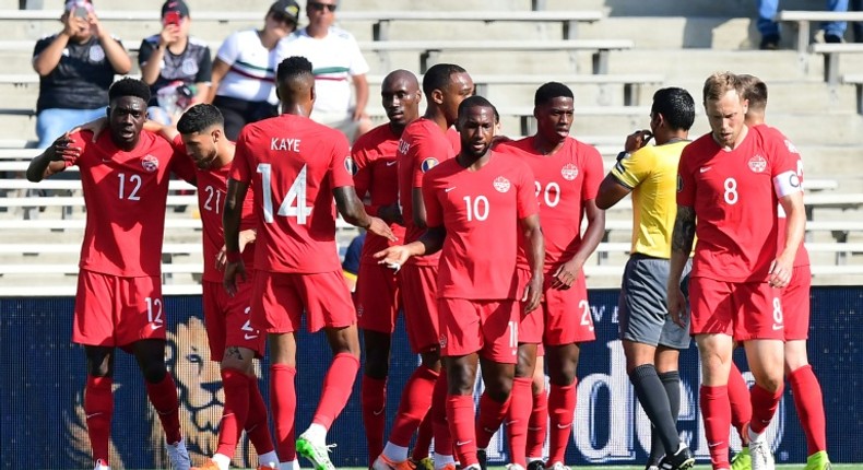 Canada celebrate Jonathan David's opening goal in a 4-0 Gold Cup defeat of Martinique