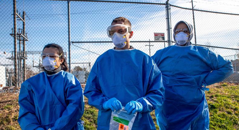 Healthcare workers wait to administer free coronavirus tests in Columbus, Ohio, on November 19.