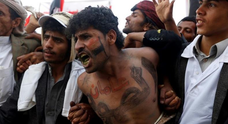 Yemeni supporters of the Huthi movement and former president Ali Abdullah Saleh at a rally to mark two years of the military intervention by the Saudi-led coalition, in the capital Sanaa on March 26, 2017