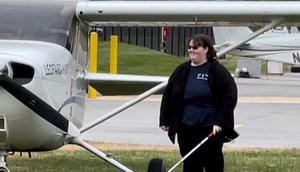 Kaiya Armstrong walking away from plane after landing in Washington DC.The Foundation for Blind Children
