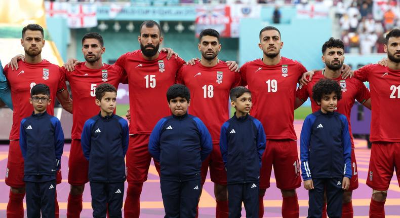 Iranian soccer players during the national anthem ahead of their Qatar 2022 World Cup match against England at the Khalifa International Stadium in Doha on November 21, 2022.Photo by FADEL SENNA/AFP via Getty Images