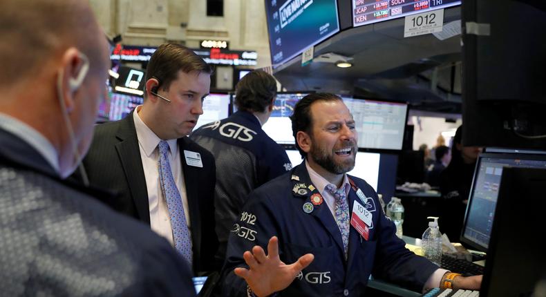 Traders work on the floor at the New York Stock Exchange (NYSE) in New York City, U.S., March 5, 2020.Andrew Kelly/Reuters