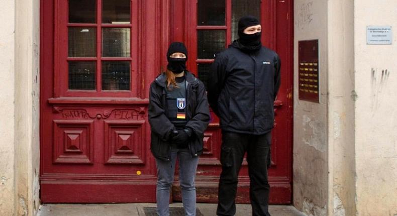 Police officers stand in front of the Fussilet 33 mosque in Berlin, raided on Tuesday