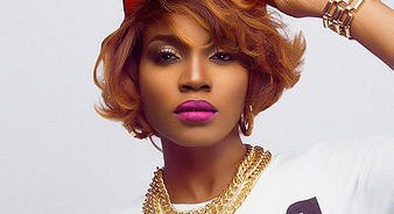 Seyi Shay uses her logo which is a double 's' with a star in the middle on her artwork and studio photos (see left of image). 