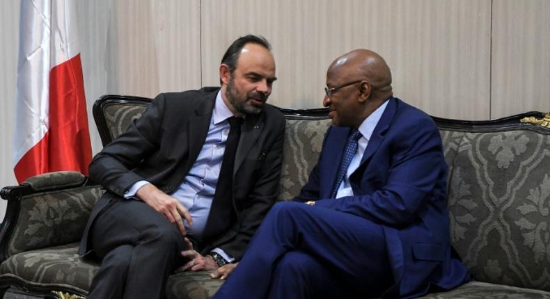 Philippe (L) spoke with his Malian counterpart Soumeylou Boubeye Maiga on arrival at Bamako's airport