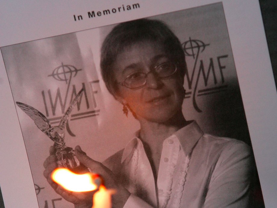 A picture of slain journalist Anna Politkovskaya is shown during a candlelight vigil in front of the Russian Embassy.