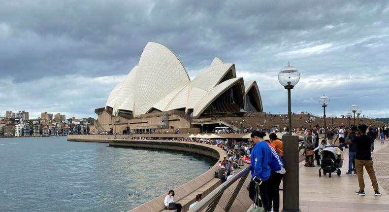 Some passengers on the Ruby Princess cruise ship were displaying flu-like symptoms when it berthed in Sydney Harbour