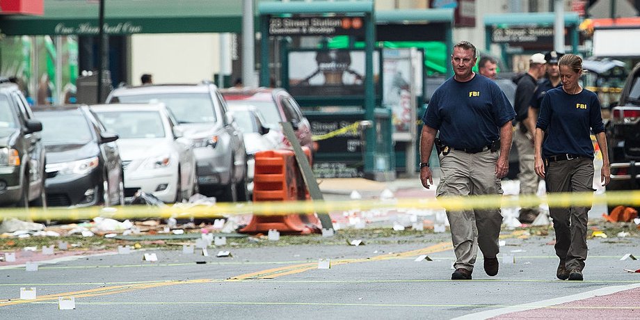 Two members of the FBI work at the scene of Saturday night's explosion in the Chelsea neighborhood of Manhattan.