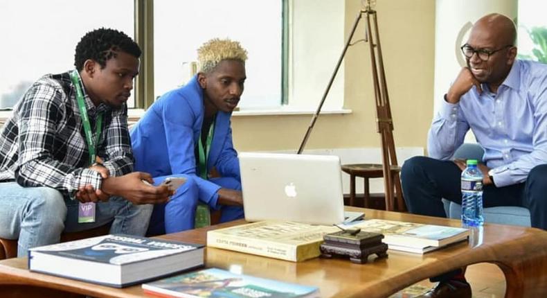 Eric Omondi with the late  Safaricom CEO Bob Collymore