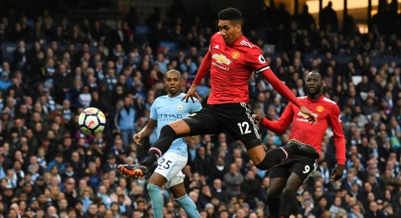 Manchester United defender Chris Smalling (centre) has signed a new contract until 2022