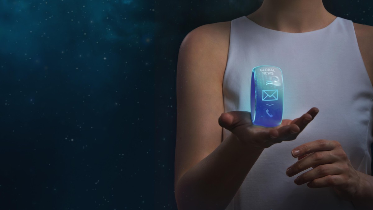 Futuristic unrecognizable woman holding smartwatch on a cosmic background