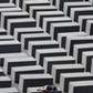 FILE PHOTO: A girl rests on a concrete column of the Holocaust memorial in Berlin