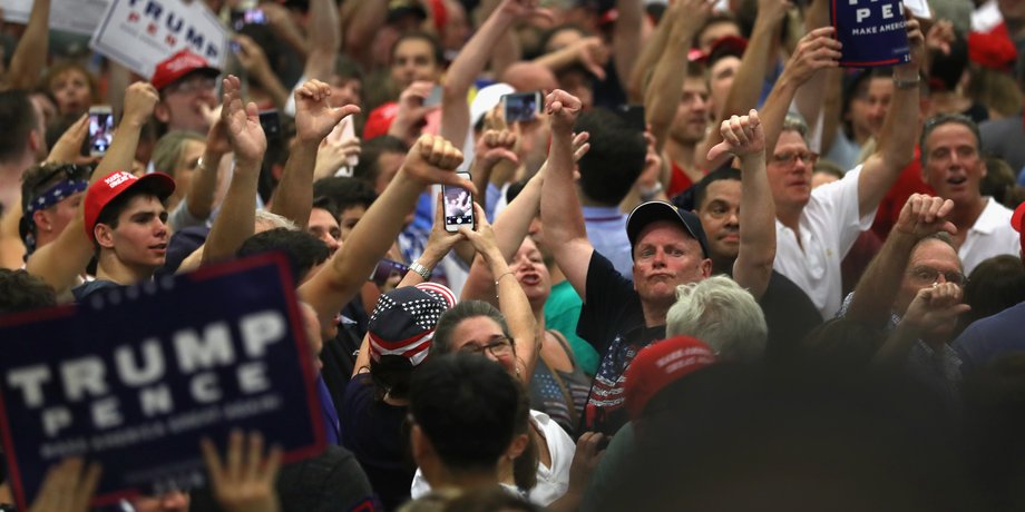 Supporters of Republican Presidential candidate Donald Trump jeer the media on August 13, 2016 in Fairfield, Connecticut.